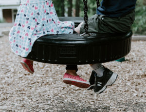 Two children on tyre swing for ASBCI story