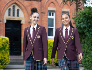 Two schoolgirls in Banner tartan skirts