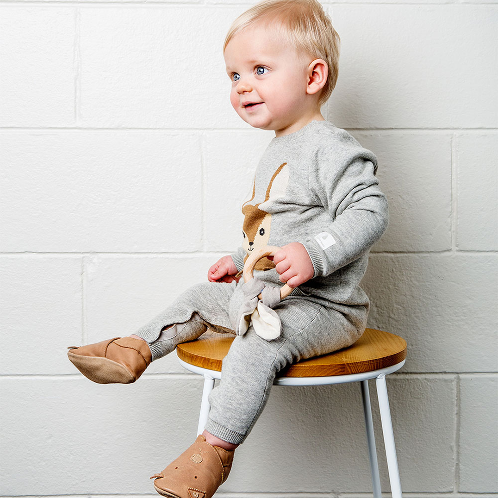 Young boy in Bobux brown baby shoe