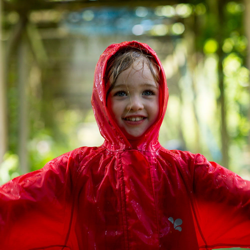 Girl in red Muddy Puddles raincoat