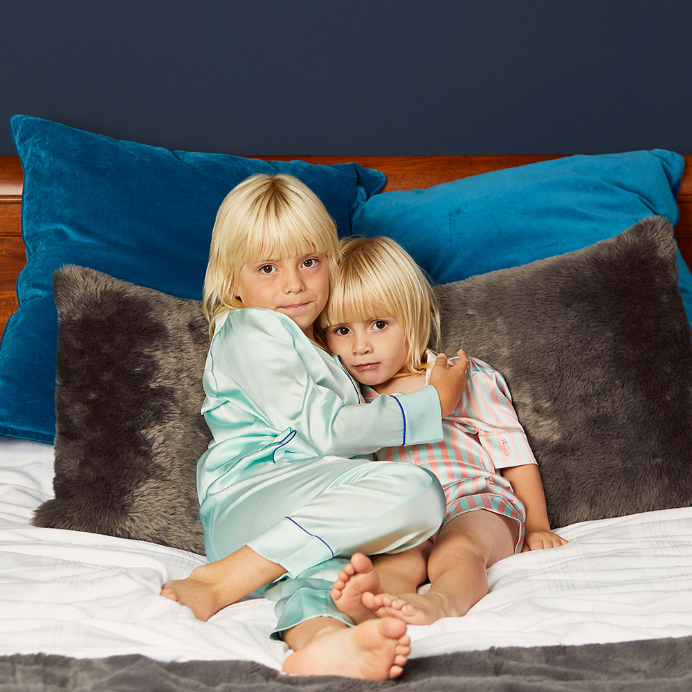 Two children wearing Sleepy Wilson pyjames