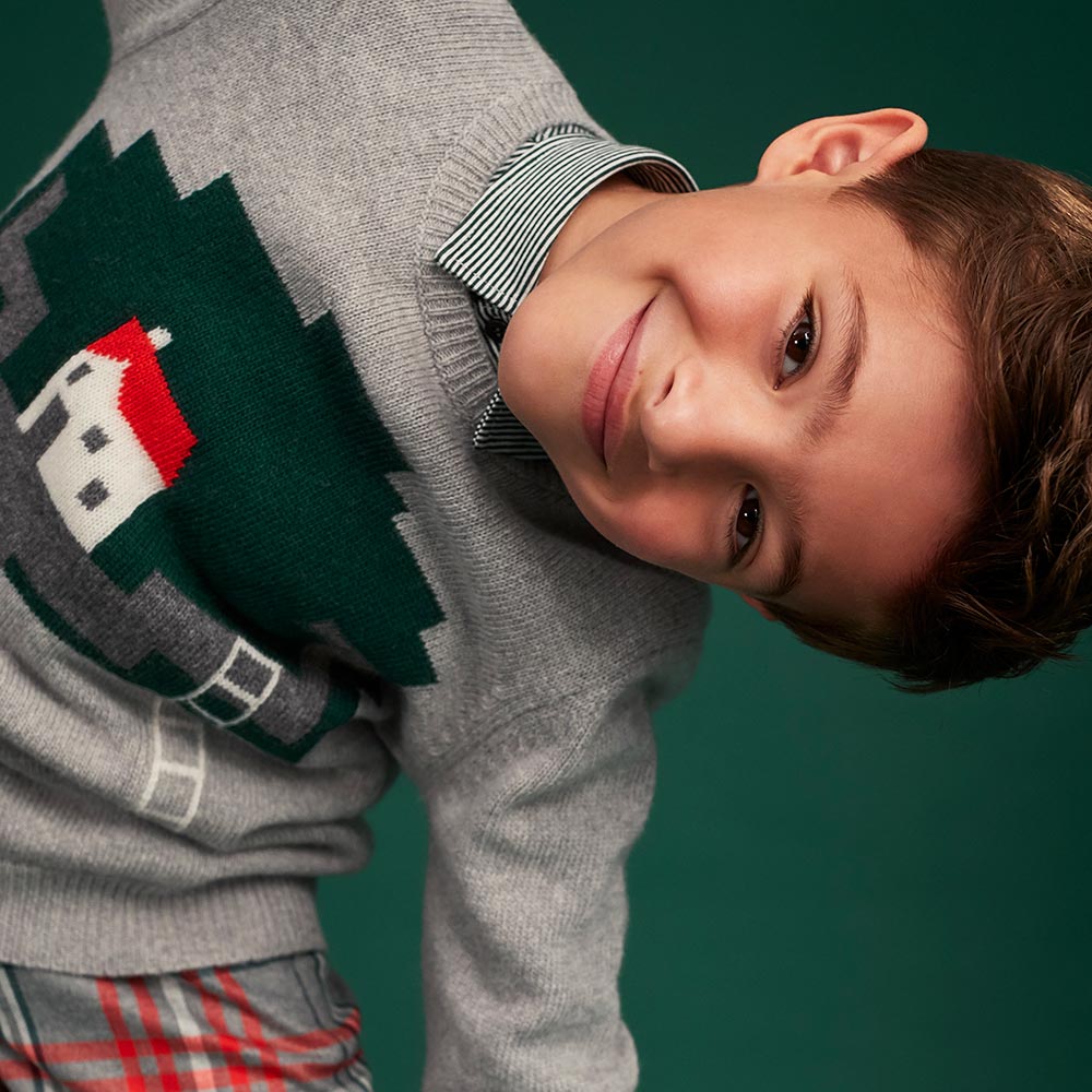 Young boy wearing Il Gufo Christmas Christmas jumper