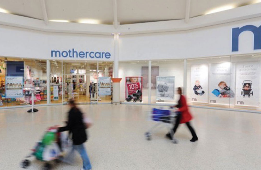 Women push prams oustide the Boots Mothercare store