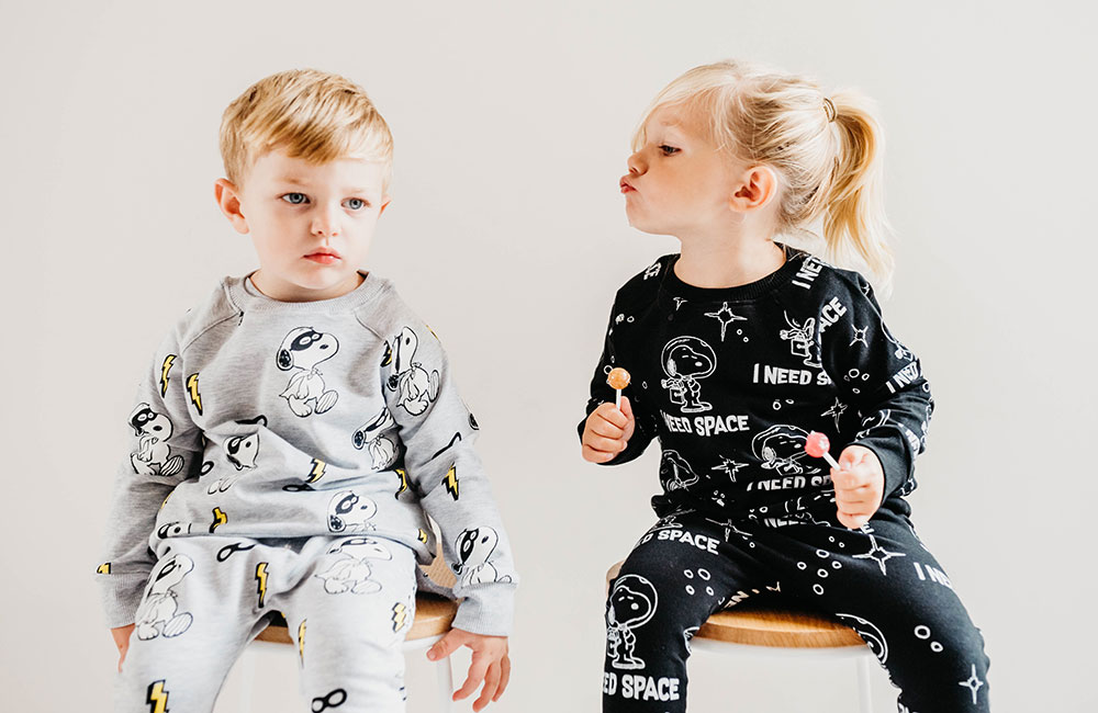 Young boy and girl wearing Peanuts x Cribstar – Snoopy collection