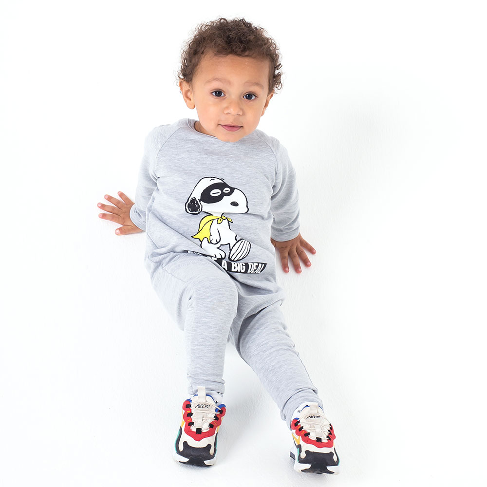 Little boy sat down wearing Peanuts x Cribstar – Snoopy collection