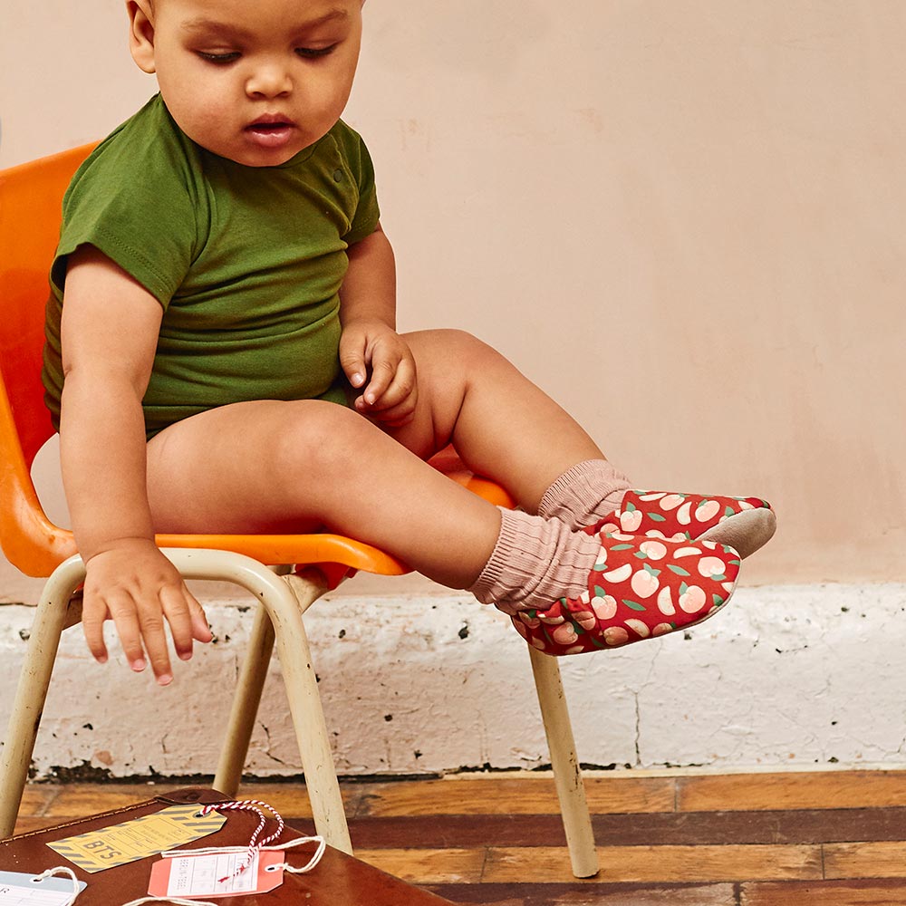 Baby in red and white Poco Nido Baby Shoes