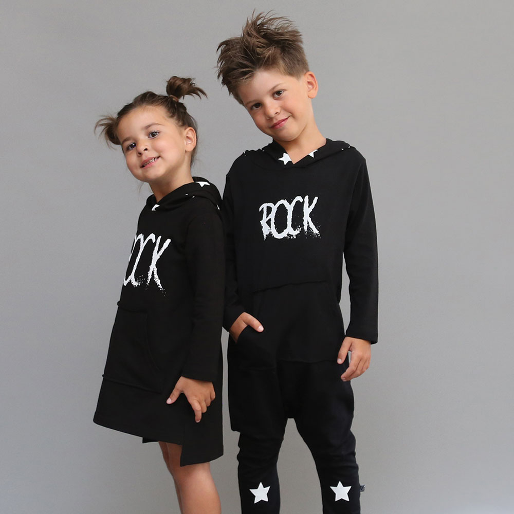 Young boy and girl in matching black T Shirts