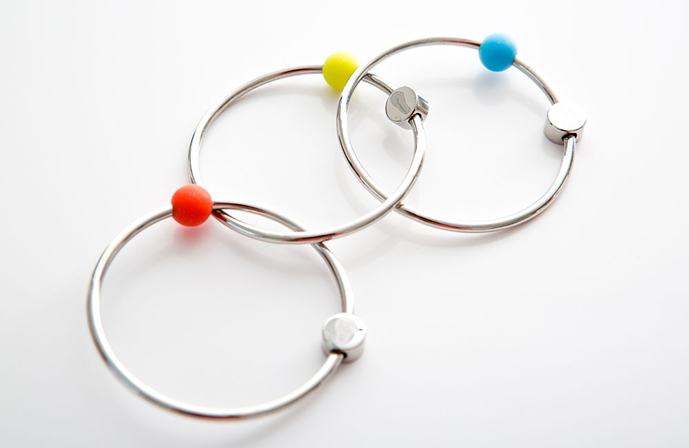 Three silver hoops with colourful bead