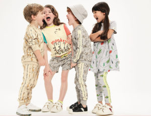 Four children in M&S clothing laughing together