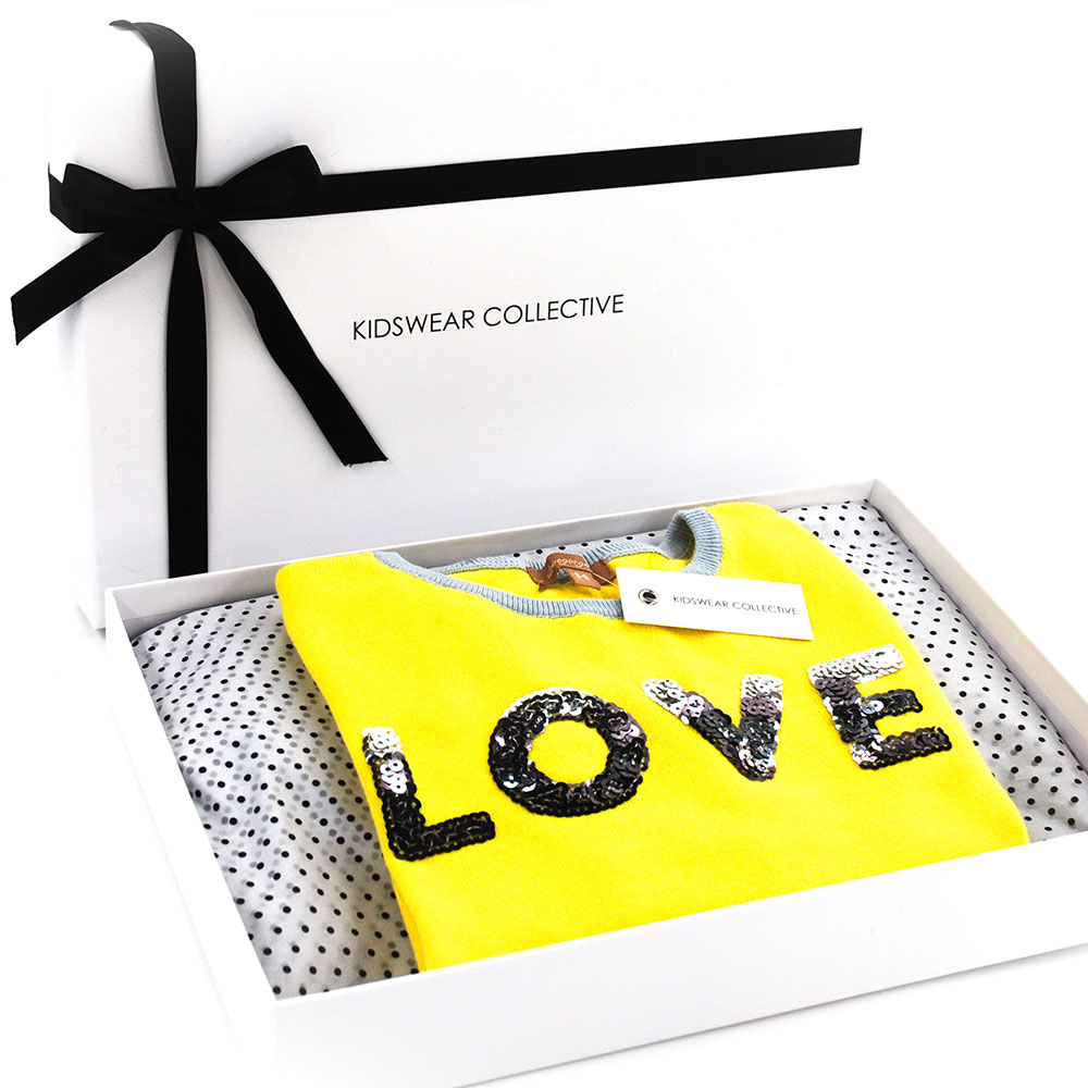 Kidswear Collective package with yellow LOVE tag
