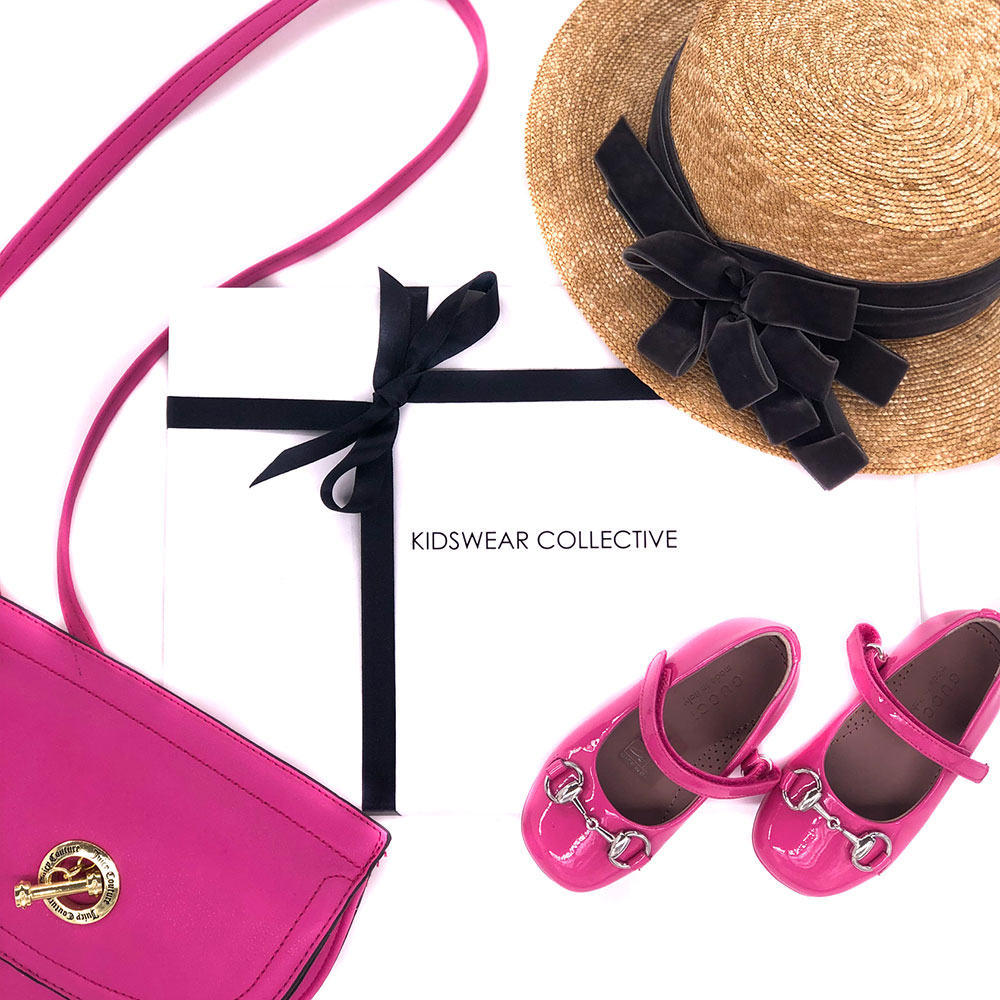 Kidswear Collective packaging with pink bag and shoes and straw hat