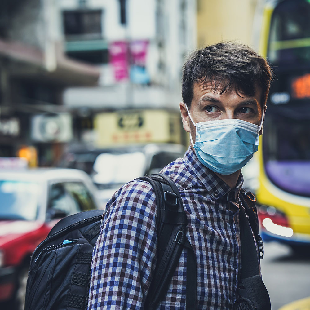 British man wearing protective face mask coronavirus guidance