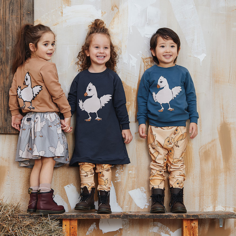 Childrenswear - three young children with duck print tops