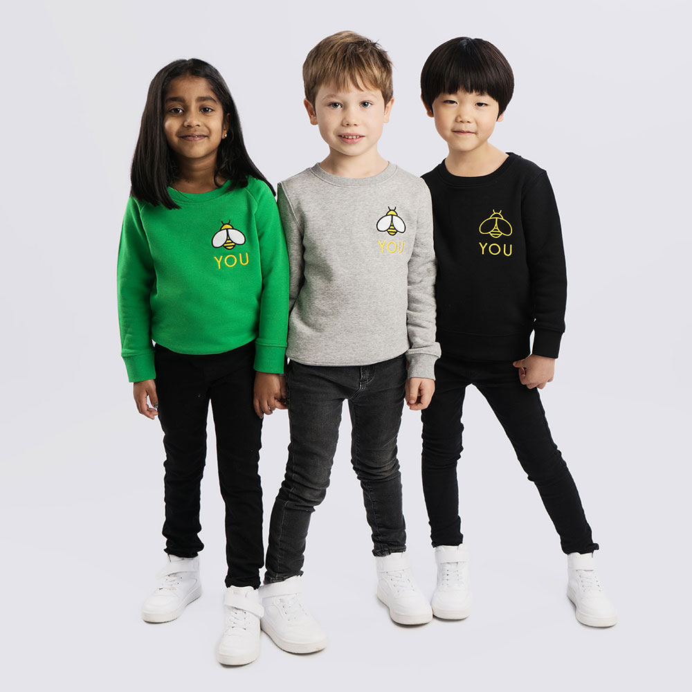 Three kids in cool LoveLux slogan sweatshirts