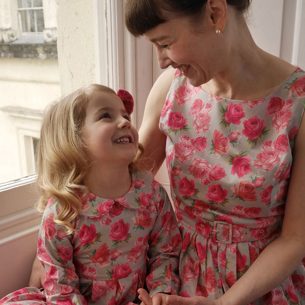 Mother and daughter in pink floral Rachel Riley dresses