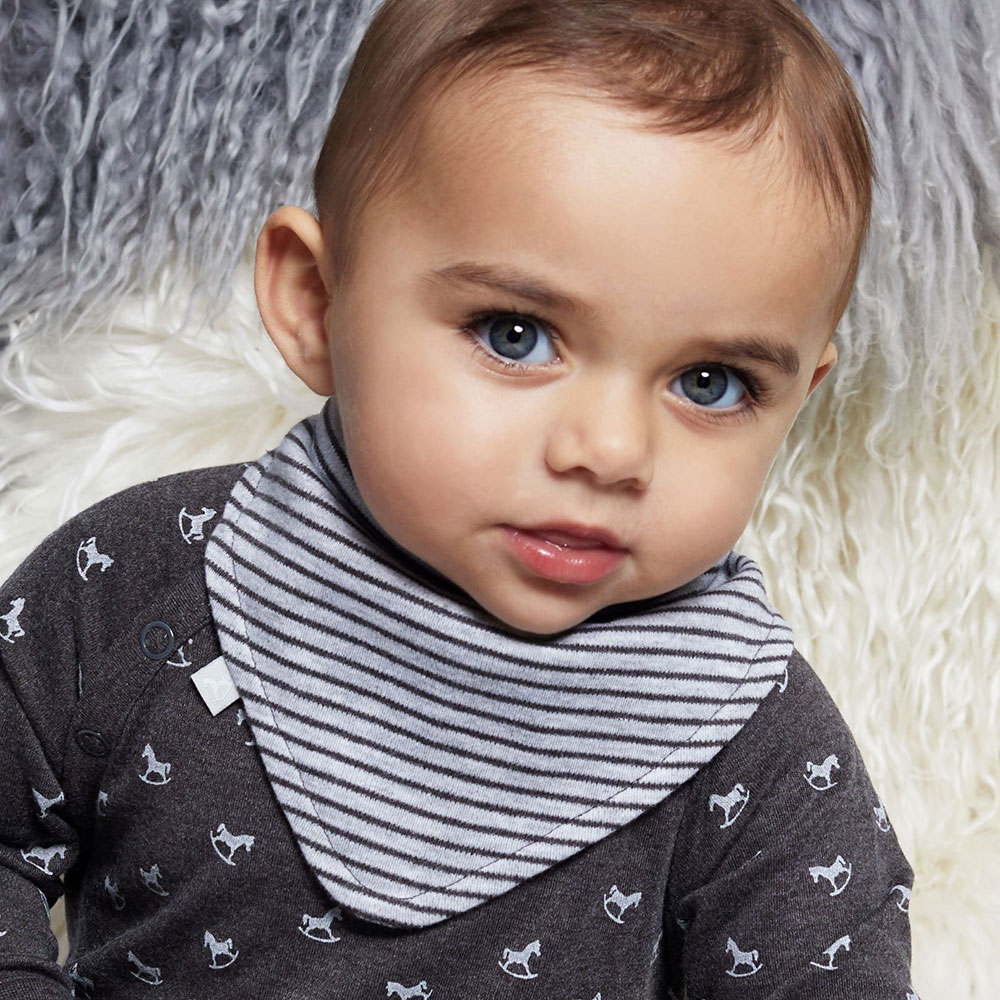 Young boy in Little Tailor grey babygro