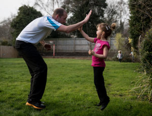 Young Child and adult doing excercise