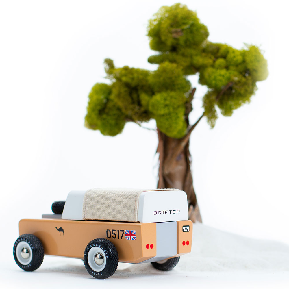 CandyLab Jeep next to a tree