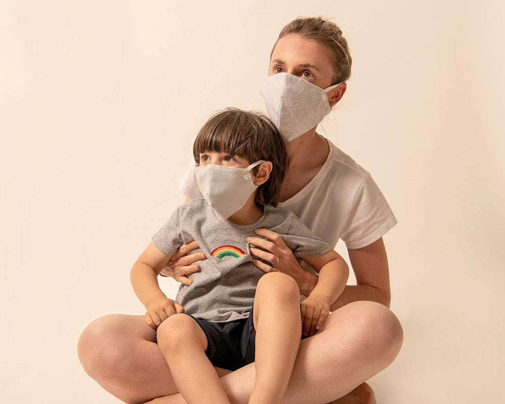 A mother and child wearing MORI reusable face masks