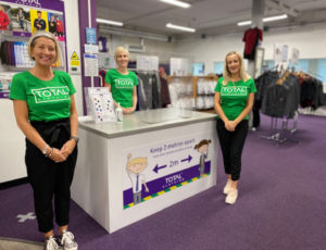 Staff at Total Clothing schoolwear store