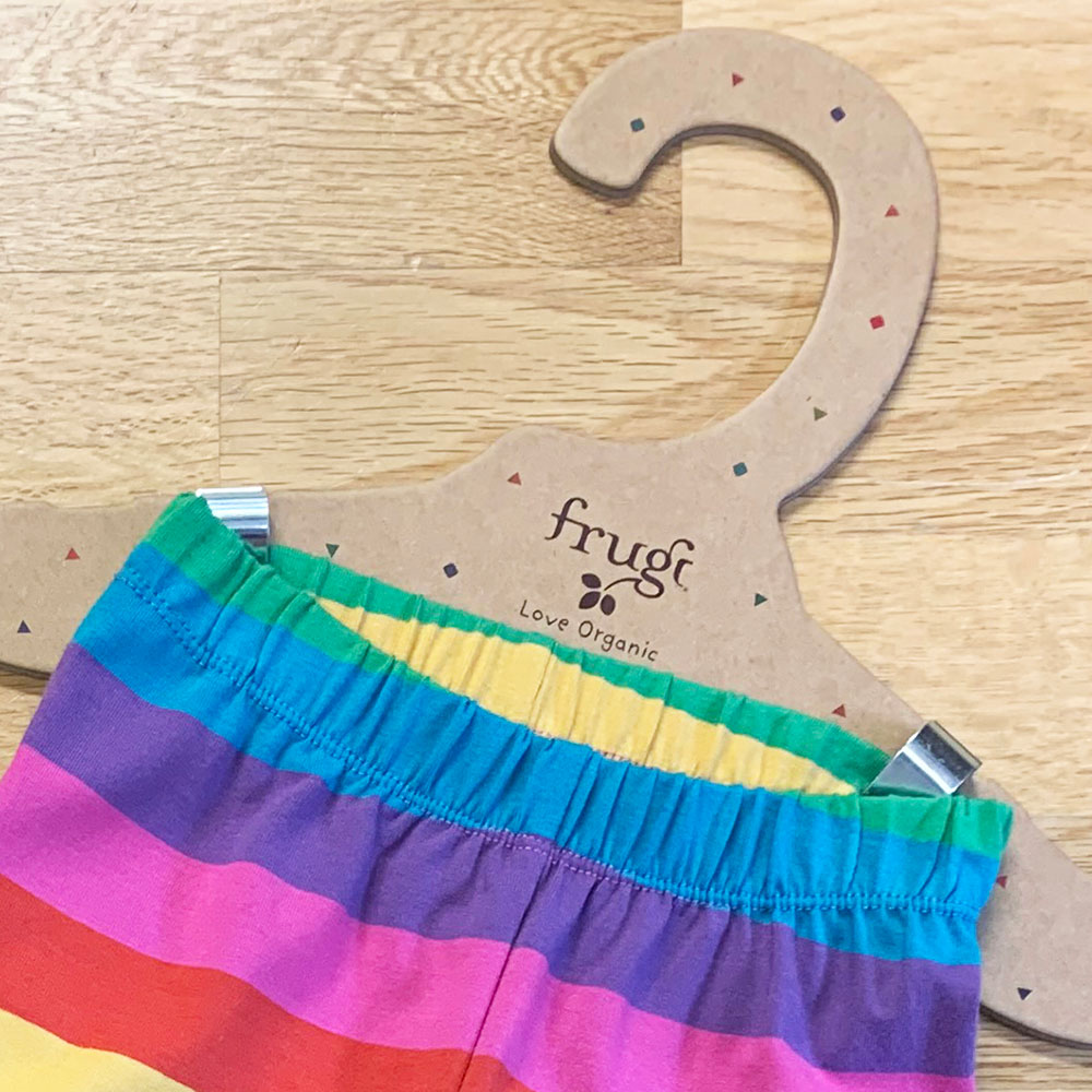 Frugi cardboard clothes hangers and colourful shorts