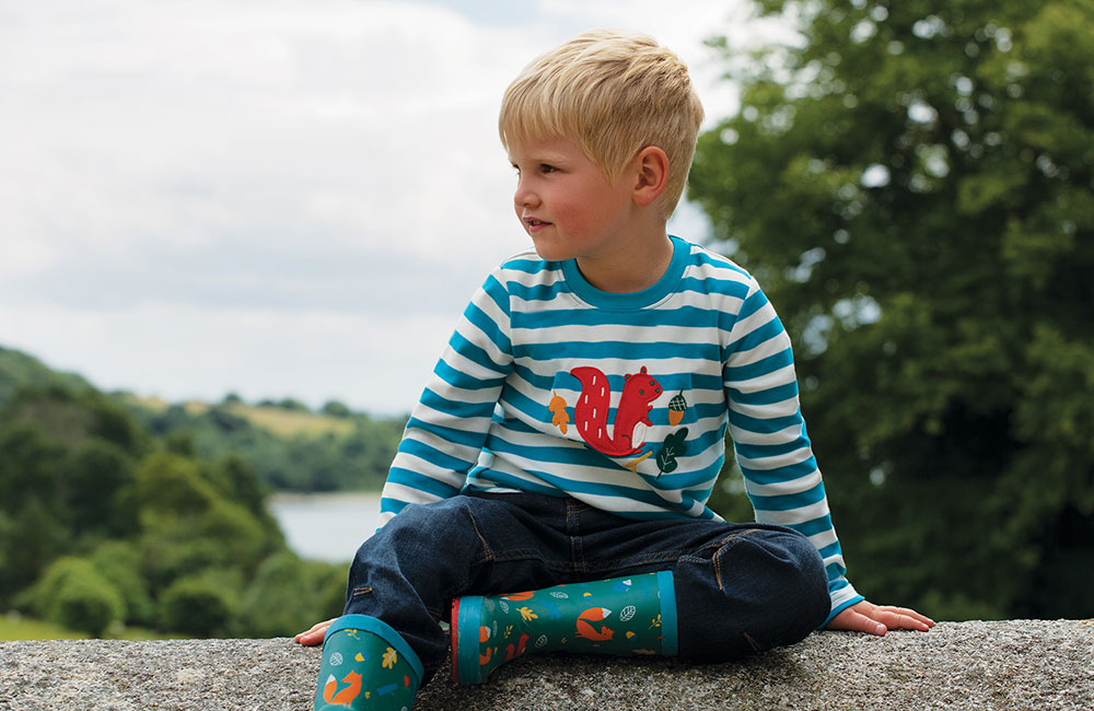 Young boy in Frugi's Woodland Trust range of kids clothing