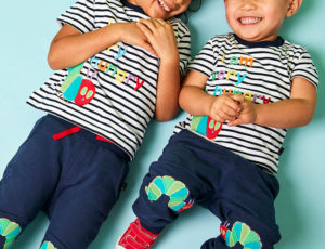 Young boy and girl wearing The Very Hungry Caterpillar clothing