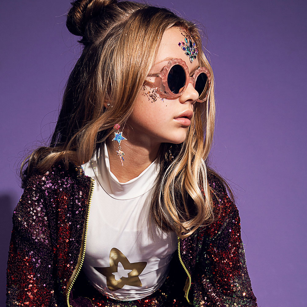 Young girl waering Zoobug glitter eyewear