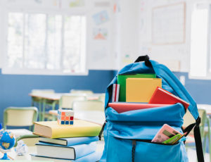 Childs backpack in school classroom