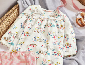 Boden Baby Basics range outfit on moses basket