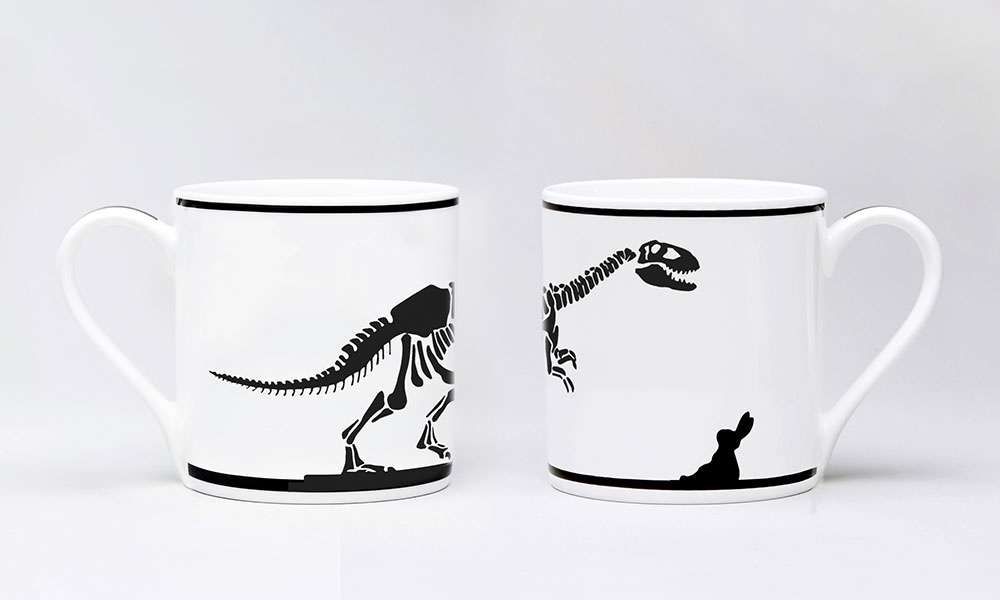 White HAM drinking mugs with black dinosaur print