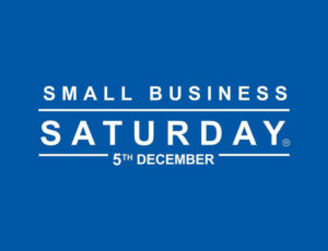 White Small Business Saturday logo on dark blue background