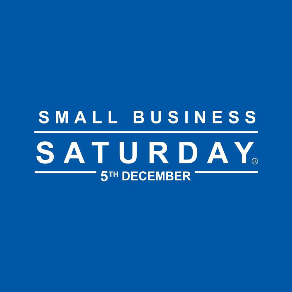 White Small Business Saturday logo on dark blue background