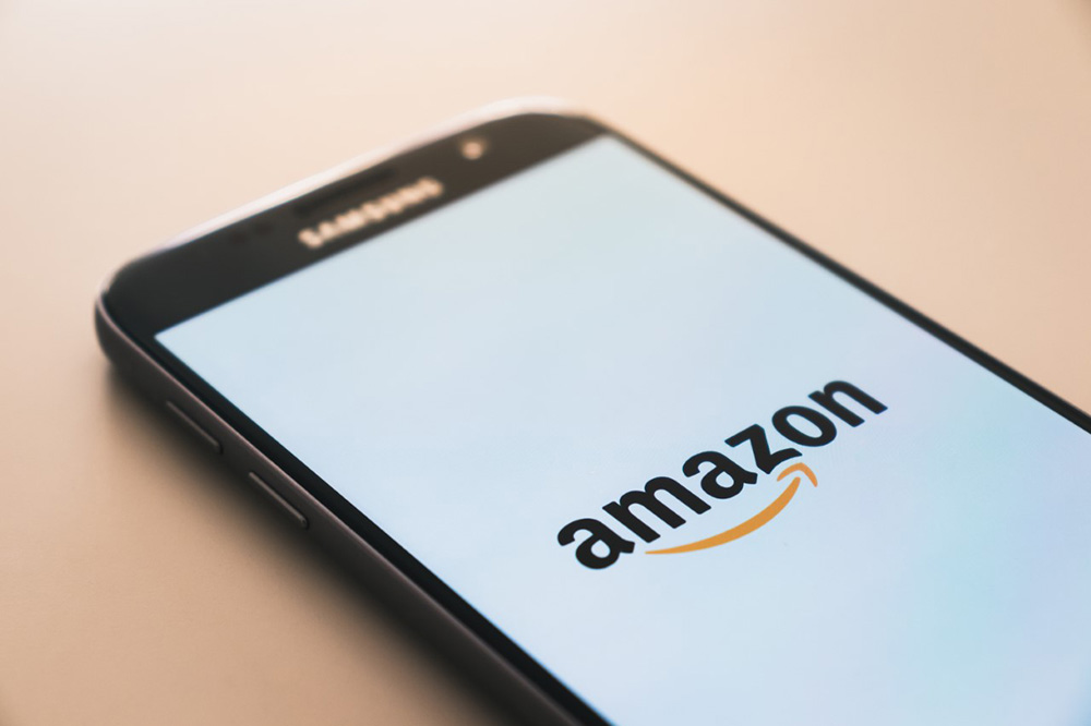 A mobile phone with the Amazon App on screen