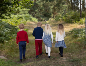 Four children walking together in the woods - Back to School Pop-Up