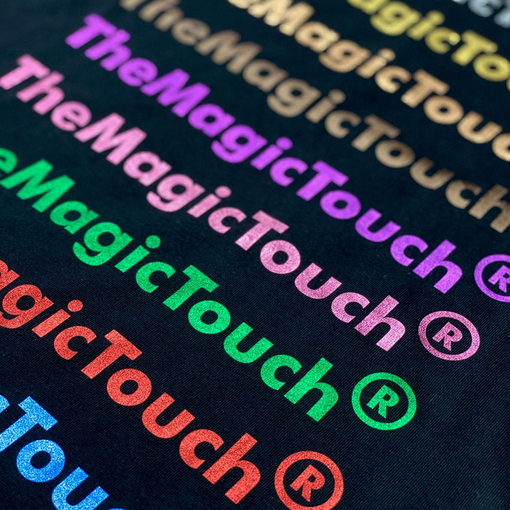 Dark material with colourful metallic wording