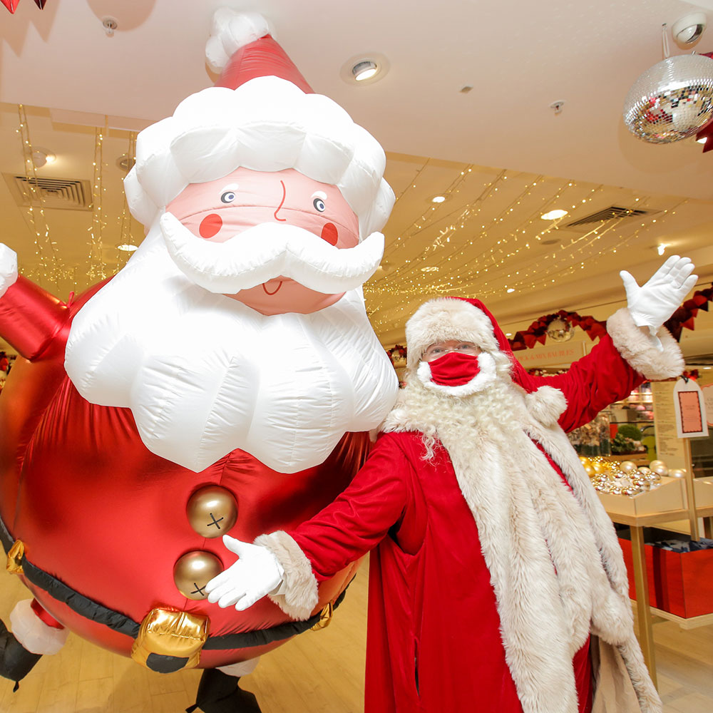 Santa and inflatable santa in the selfridges store