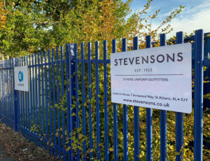 Blue railings and white Stevensons sign