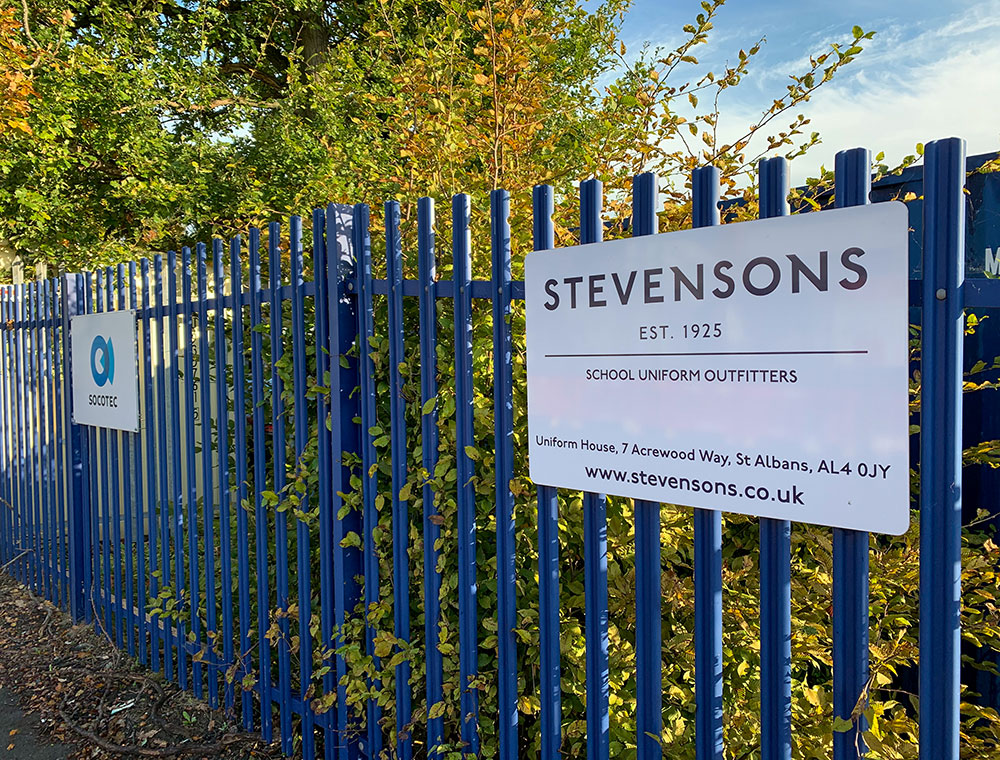 Blue railings and white Stevensons sign