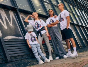 Group of four children standing. Wearing white T Shirts with Gorilla branding