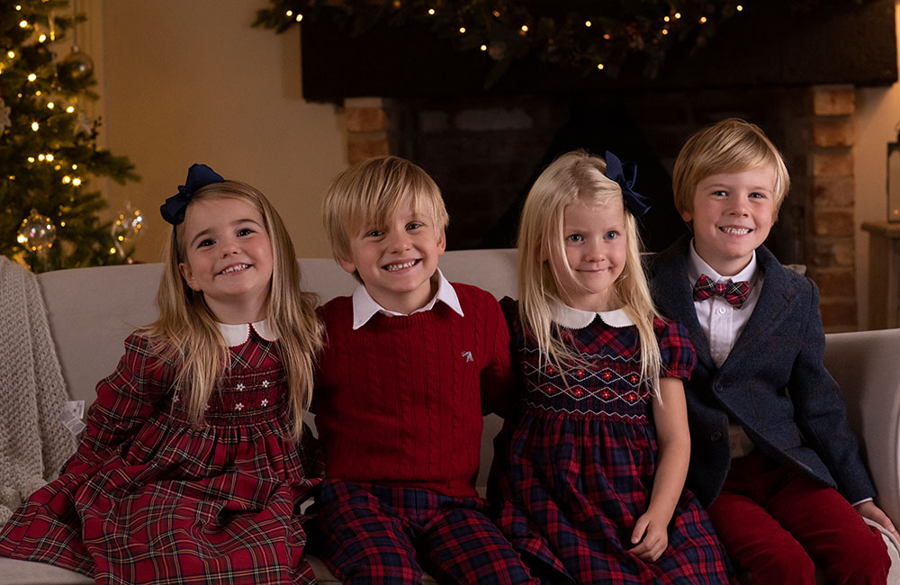 Four young children in Trotters clothing for Christmas campaign