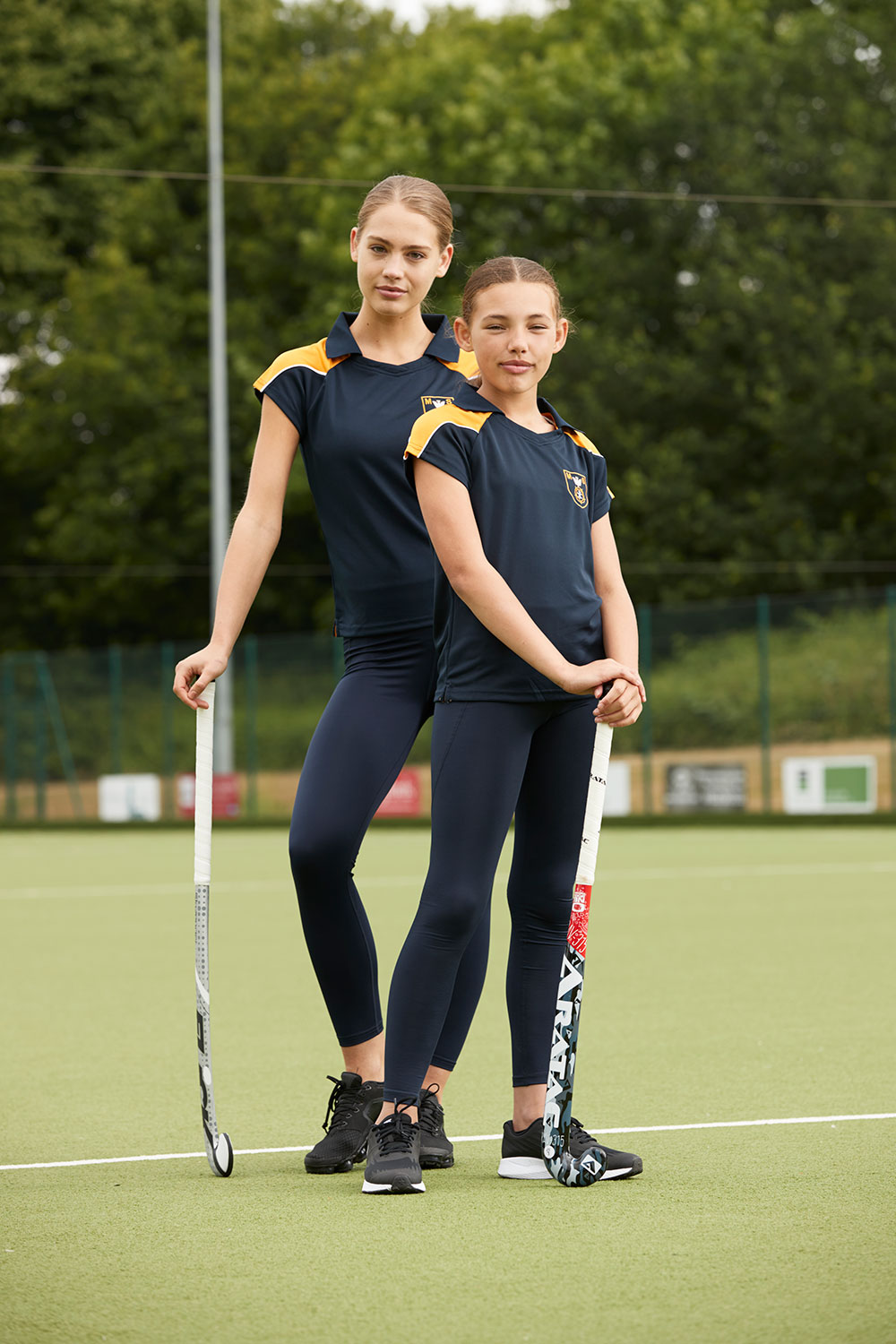 Two teenage girls wearing Chadwick Teamwear