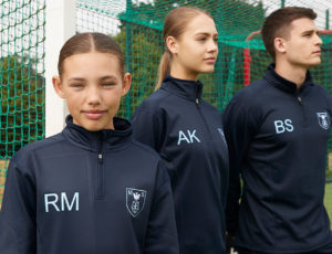 Three teenagers wearing Chadwick Teamwear