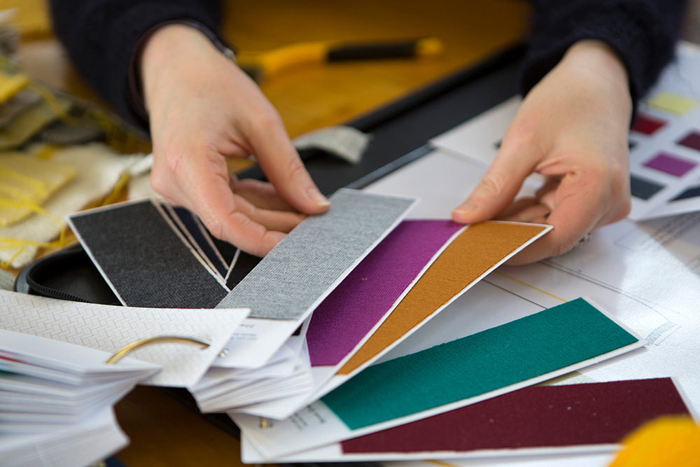 A student looking through fabric samples