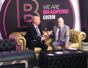 We are Bradford interview with two men sat on yellow sofa