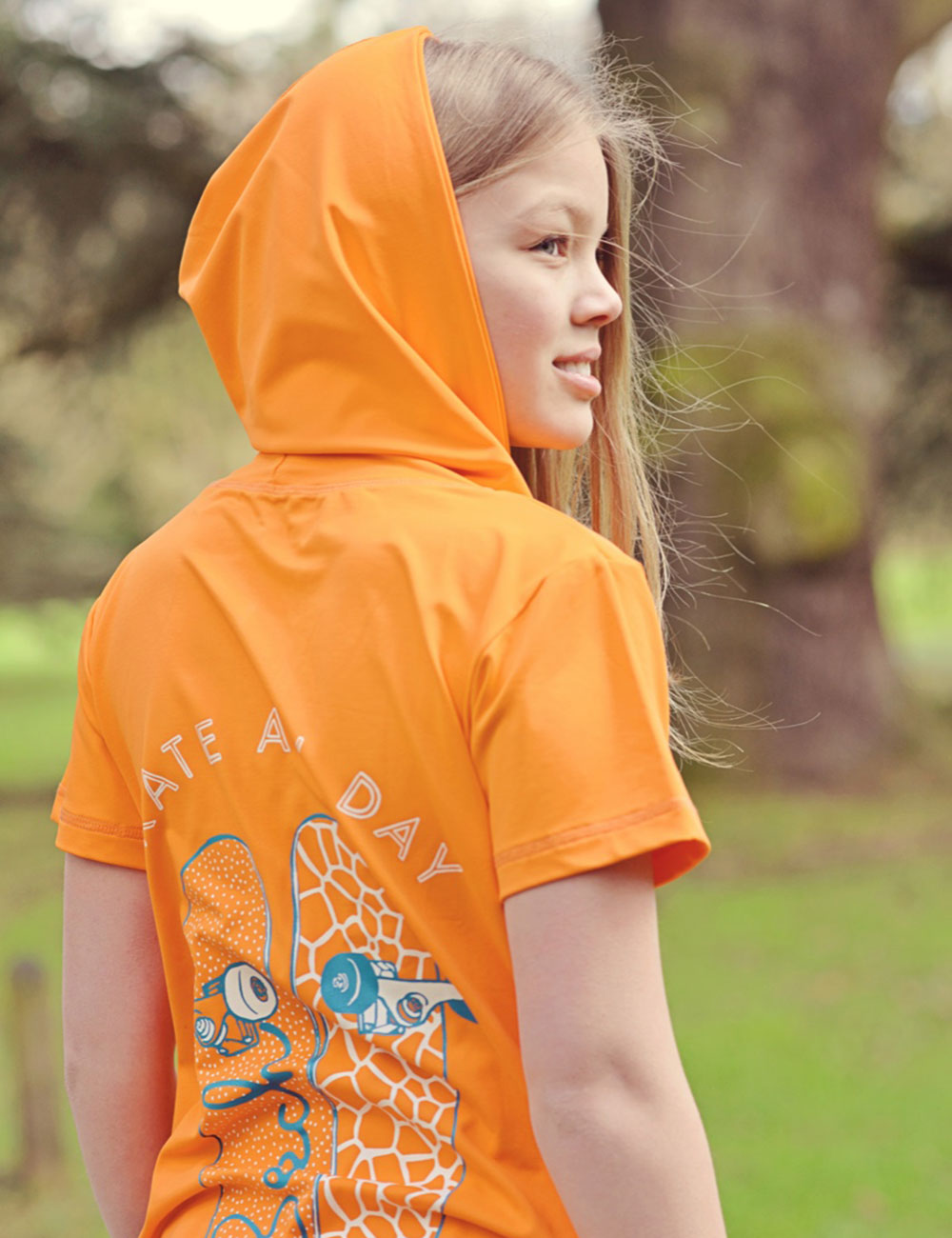 Young girl in hooded orange Beech T shirt