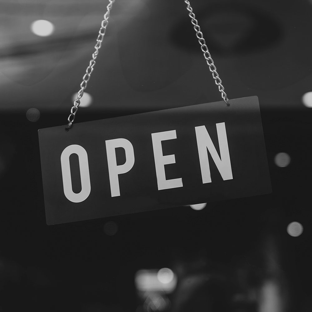Store Open sign hanging in door window - Bira and Google