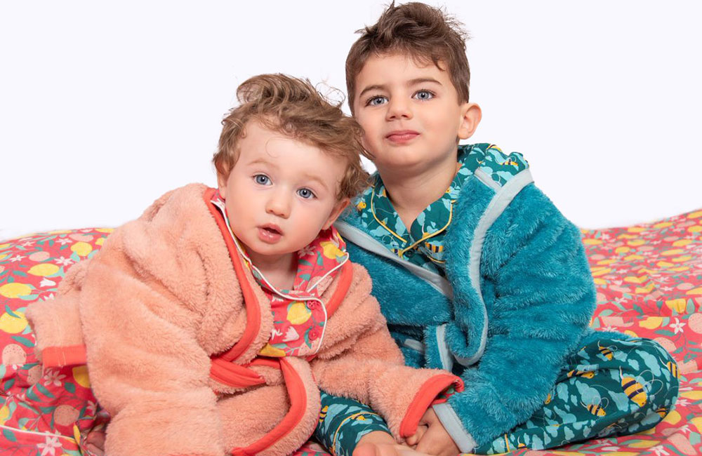 Two young boys in colourful dressing gowns
