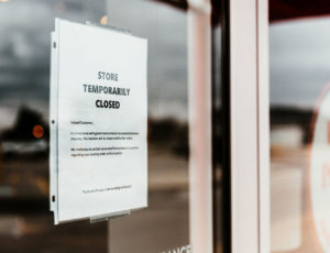 Store temporary closed sign in store window - government guidance for retailers