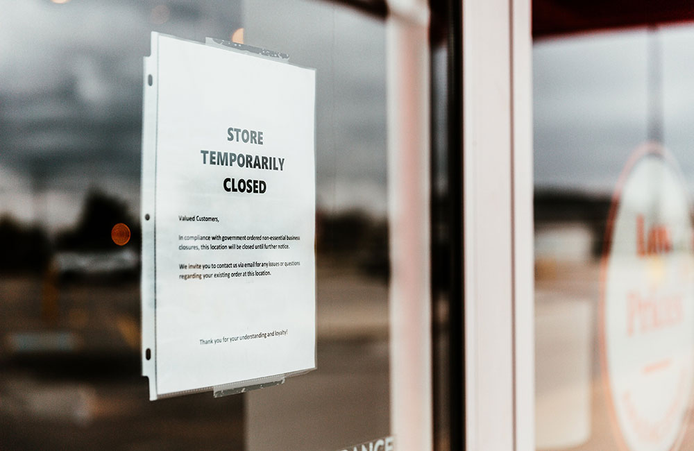 Store temporary closed sign in store window - government guidance for retailers